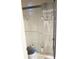 Bathroom shower with glass doors and white tile at 1727 Coco Palm Cir, Sun City Center, FL 33573