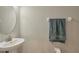 Simple bathroom with a single vanity and round mirror at 18843 Ulmus St, Lutz, FL 33558