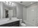 Clean bathroom with tub, toilet and vanity at 18843 Ulmus St, Lutz, FL 33558