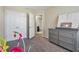 Spacious bedroom with double doors to the bathroom and walk-in closet at 18843 Ulmus St, Lutz, FL 33558