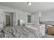 Bright bedroom featuring a large bed, crib, and plenty of storage at 18843 Ulmus St, Lutz, FL 33558