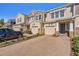 Townhome building showcasing a paved driveway and neatly maintained landscaping at 18843 Ulmus St, Lutz, FL 33558