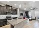Kitchen island with granite countertop and double sink at 18843 Ulmus St, Lutz, FL 33558