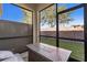 Screened patio with fire pit and seating area at 18843 Ulmus St, Lutz, FL 33558