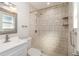 Updated bathroom with a walk-in shower and tile surround at 2746 Hibiscus St, Sarasota, FL 34239