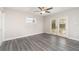 Bright bedroom with wood-look floors and access to the backyard at 2746 Hibiscus St, Sarasota, FL 34239