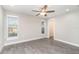 Spacious bedroom with wood-look floors and double French doors leading to the backyard at 2746 Hibiscus St, Sarasota, FL 34239