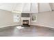 Modern corner fireplace with shiplap surround and gray tile hearth at 2746 Hibiscus St, Sarasota, FL 34239