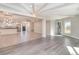 Bright living room features an open floor plan, high ceilings, and wood-look tile floors at 2746 Hibiscus St, Sarasota, FL 34239