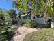 House exterior with palm trees and walkway at 2925 Clinton S St, Gulfport, FL 33707