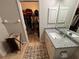 Bathroom with granite countertop, walk-in shower and large closet at 3087 Seth Rd, North Port, FL 34288