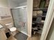 Updated bathroom with a walk-in shower and linen closet at 3087 Seth Rd, North Port, FL 34288