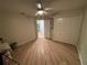 Well-lit bedroom with double-door closet and ceiling fan at 3087 Seth Rd, North Port, FL 34288