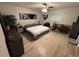 Spacious bedroom with wood-look floors and ceiling fan at 3087 Seth Rd, North Port, FL 34288