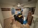 Bright bedroom featuring hardwood floors and built-in shelving at 3087 Seth Rd, North Port, FL 34288