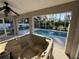 Enjoy the hot tub overlooking the refreshing pool at 3087 Seth Rd, North Port, FL 34288