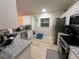 Updated kitchen featuring stainless steel appliances and light wood flooring at 3087 Seth Rd, North Port, FL 34288