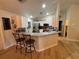 Modern kitchen with granite countertops, stainless steel appliances, and an island at 3087 Seth Rd, North Port, FL 34288