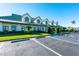 Community clubhouse with parking and landscaping at 3447 Malachite Dr, Zephyrhills, FL 33540