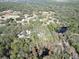 Aerial view of a home and land with surrounding trees at 39716 Tworut Rd, Webster, FL 33597