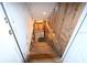 Unfinished basement stairs with exposed wooden framing at 39716 Tworut Rd, Webster, FL 33597