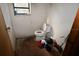 Small bathroom with toilet and wood floor at 39716 Tworut Rd, Webster, FL 33597