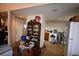 Kitchen area with wood cabinets and a full-size refrigerator at 39716 Tworut Rd, Webster, FL 33597