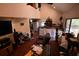 Open living area with high ceilings and a view of the kitchen at 39716 Tworut Rd, Webster, FL 33597