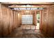Interior view of a storage shed with garage door at 39716 Tworut Rd, Webster, FL 33597