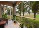 Relaxing screened porch with view of backyard at 4010 Bismarck Palm Dr, Tampa, FL 33610