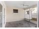 Cozy screened porch with ceiling fan at 4336 Swallowtail Dr, New Port Richey, FL 34653