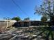 View of home's back and backyard at 4718 Eldorado Dr, Tampa, FL 33615