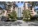 Upscale condo complex with mature trees and circular drive at 4951 Bacopa S Ln # 302, St Petersburg, FL 33715