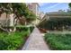 Well-maintained walkway surrounded by lush landscaping at 4951 Bacopa S Ln # 302, St Petersburg, FL 33715