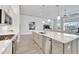 Sleek kitchen island with sink, dishwasher, and ample counter space at 5316 Loon Nest Ct, Apollo Beach, FL 33572