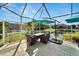 Screened patio with seating area overlooking the water at 5316 Loon Nest Ct, Apollo Beach, FL 33572