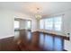 Bright dining room with hardwood floors and antler chandelier at 606 N Merrin St, Plant City, FL 33563