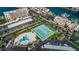 Aerial view of community amenities, including tennis courts and pools at 7400 Sun Island S Dr # 104, South Pasadena, FL 33707