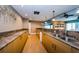 Full bar with granite countertops and wooden cabinets at 7400 Sun Island S Dr # 104, South Pasadena, FL 33707