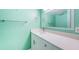 Bathroom with vanity, quartz countertop and mirror at 7400 Sun Island S Dr # 104, South Pasadena, FL 33707