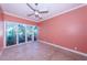 Bedroom with sliding doors to balcony and tile floors at 7400 Sun Island S Dr # 104, South Pasadena, FL 33707