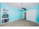 Bright bedroom with tile floors and ceiling fan at 7400 Sun Island S Dr # 104, South Pasadena, FL 33707