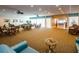 Relaxing community room with tables and wicker chairs at 7400 Sun Island S Dr # 104, South Pasadena, FL 33707