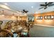 Game room with bar, seating, and dartboards at 7400 Sun Island S Dr # 104, South Pasadena, FL 33707