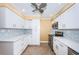 Updated kitchen with white cabinets and stainless steel appliances at 7400 Sun Island S Dr # 104, South Pasadena, FL 33707