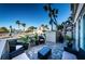 Relaxing patio with seating area, overlooking pool and water at 7400 Sun Island S Dr # 104, South Pasadena, FL 33707