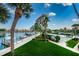 Stunning view of waterfront property with boat slips and lush landscaping at 7400 Sun Island S Dr # 104, South Pasadena, FL 33707