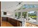 Modern kitchen with a large island, stainless steel appliances, and water views at 808 Monterey Ne Blvd, St Petersburg, FL 33704