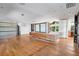 Open living room with hardwood floors and built-in shelving at 808 Monterey Ne Blvd, St Petersburg, FL 33704
