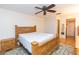 Main bedroom with wood furniture and ceiling fan at 8493 Cypress Lake Cir, Sarasota, FL 34243